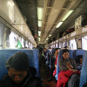 February_12__2015_at_0127PM_Train_to_Kunming._Hard_seat_this_time._5_seats_in_a_row.